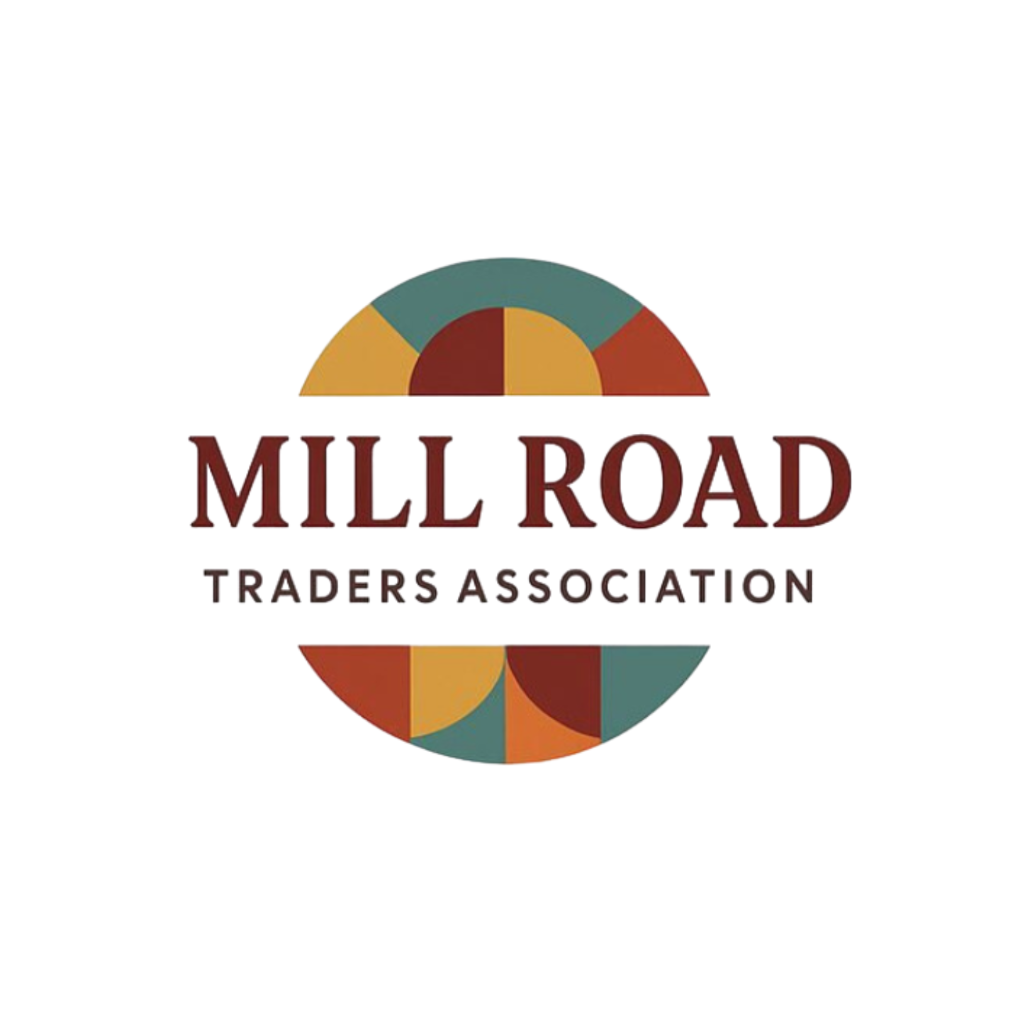 Mill Road Traders Association logo centered on a white background, featuring a circular geometric emblem in muted teal, mustard, rust, and brown with the text 'MILL ROAD TRADERS ASSOCIATION' below.