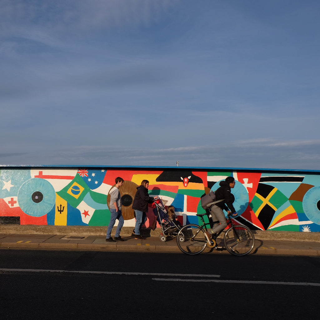 mill road bridge with people in front of the mural 